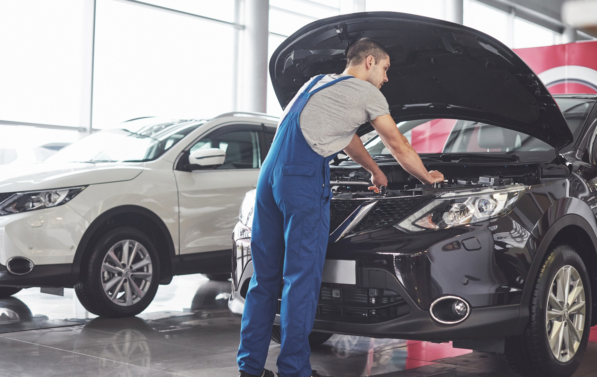 Mechanic performing vehicle maintenance